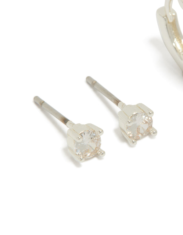 Designed with silver plated cubic zirconia studs and flower huggie earrings in a 2-pack close up view