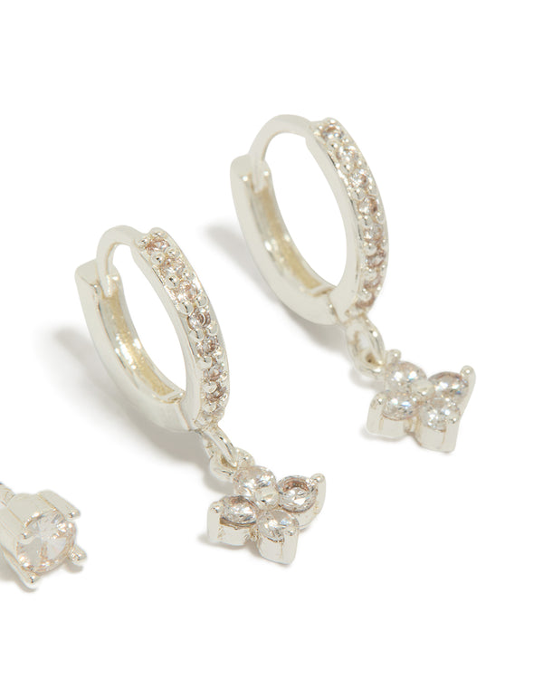 Designed with silver plated cubic zirconia studs and flower huggie earrings in a 2-pack close up view