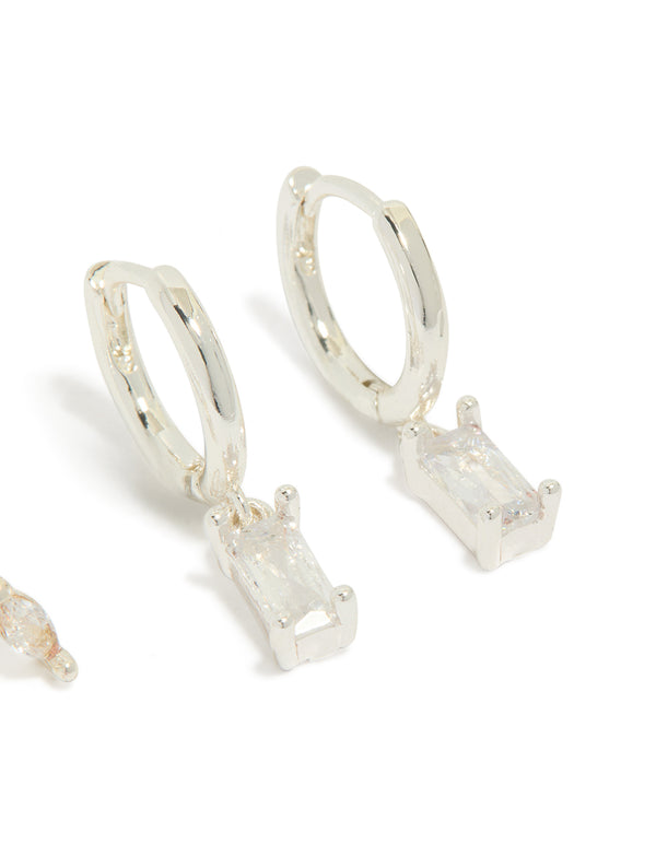 Featuring dainty leaf studs with baguette cut cubic zirconia in silver plated 2-pack close up view