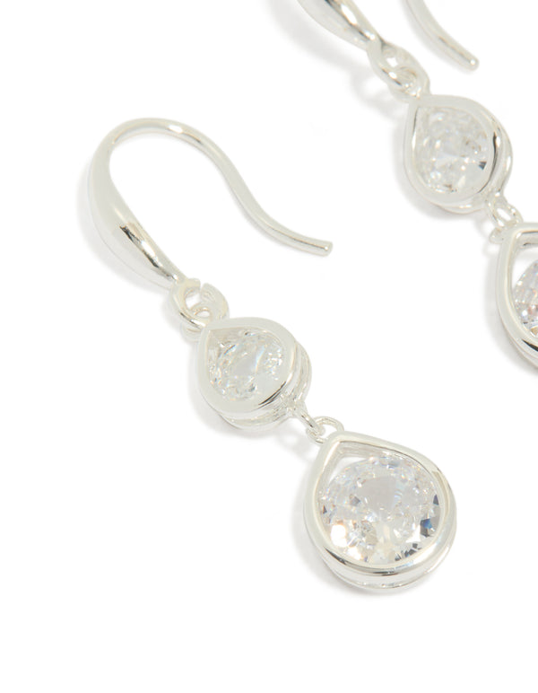 Highlighting silver plated double teardrop hook earrings with clear cubic zirconia close up view