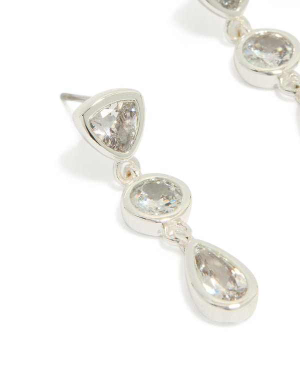 Highlighting silver plated cubic zirconia organic circles triple drop earrings close up view
