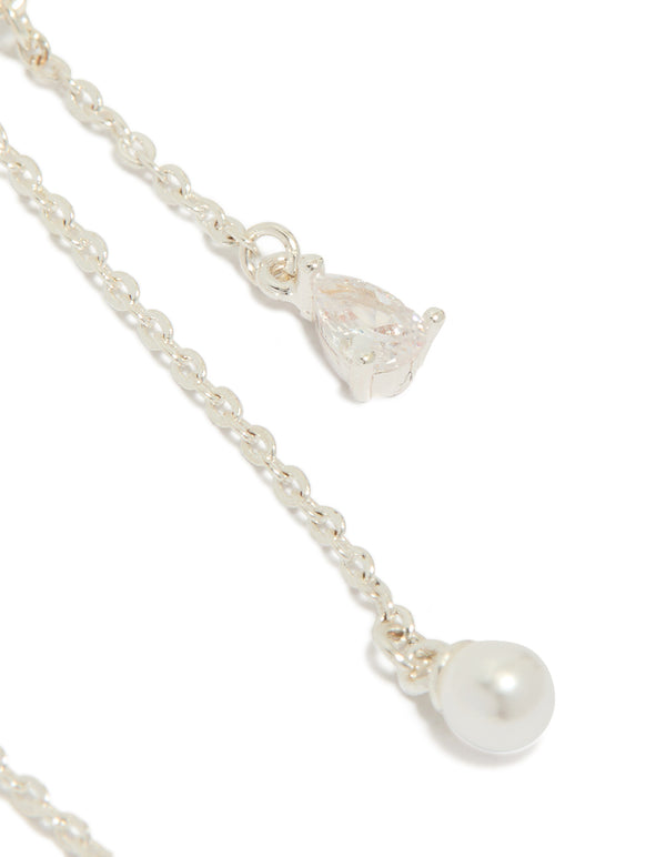 Highlighting silver plated cubic zirconia moon and butterfly drop earrings featuring celestial charm pearl teardrop post detail view