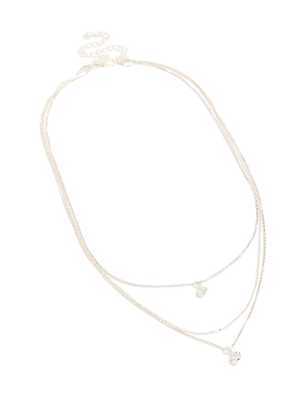 Featuring a triple-layered drop necklace with beads, round-cut cubic zirconia, crafted from silver-plated material in a silver color front view
