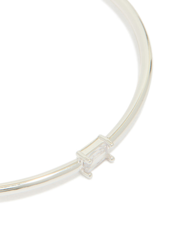 Displaying silver plated rectangular and teardrop cubic zirconia bangles in a 2-pack close up view
