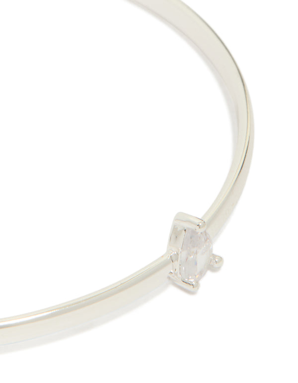 Displaying silver plated rectangular and teardrop cubic zirconia bangles in a 2-pack close up view