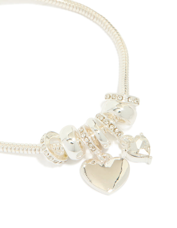 Featuring silver plated diamante heart rondell charm bracelet with beads in close up view