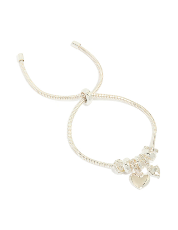 Showcasing a silver plated diamante heart rondell charms bracelet with beads and toggle closure front view