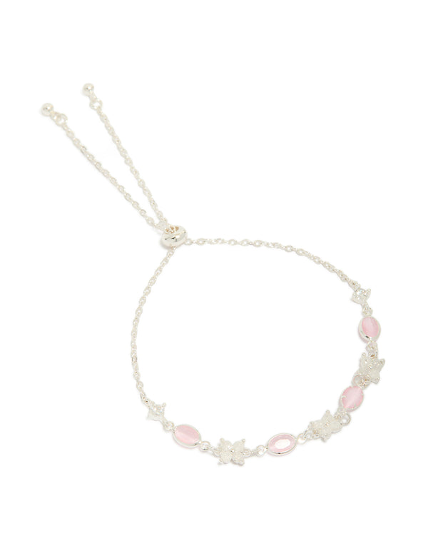 Crafted from silver plated metal, this oval toggle bracelet features floral charms with cubic zirconia accents in pink and clear front view