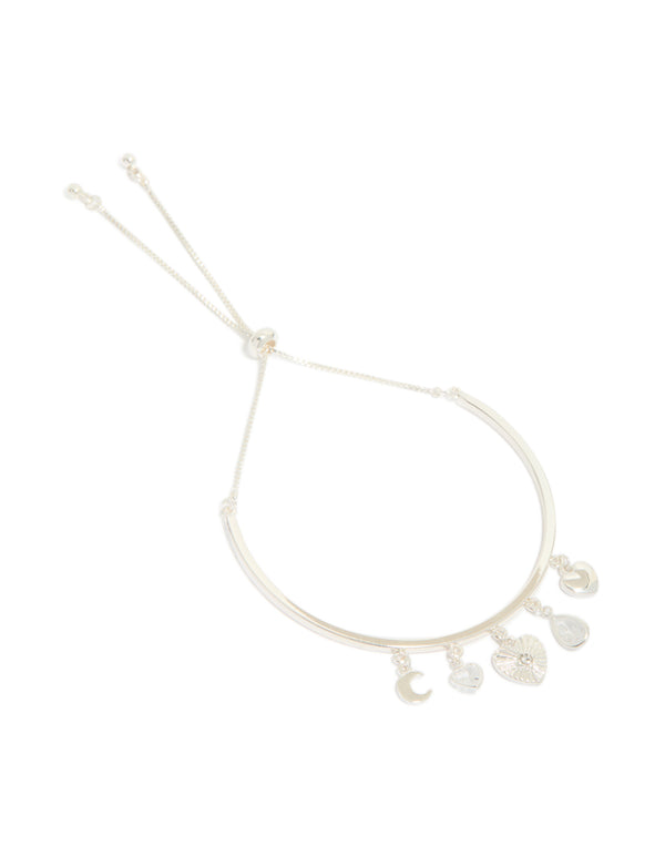 Showcasing a silver plated moon and heart charm toggle bangle with celestial details front view
