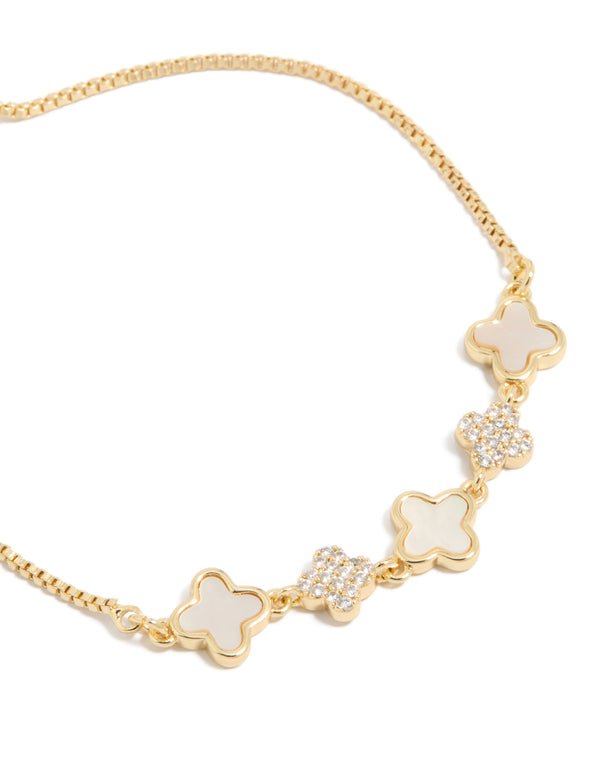 Chic gold plated bracelet featuring cubic zirconia and floral ivory pattern close up view