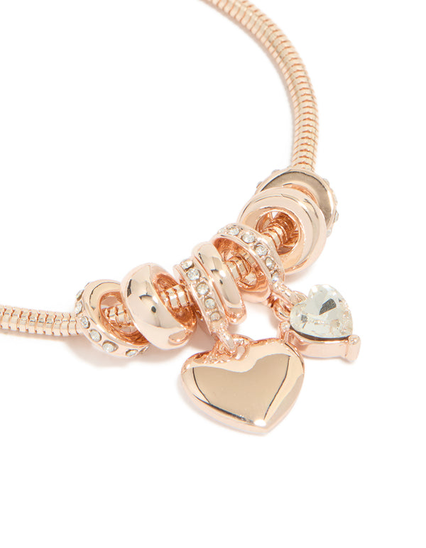 Featuring a rose gold plated diamante heart charm toggle bracelet with dainty design close up view