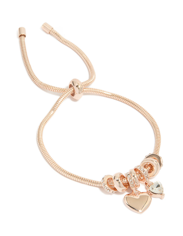 Showcasing a rose gold plated diamante heart charm toggle bracelet with dainty styling front view