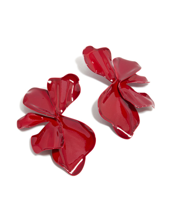 Showcasing large statement stud earrings with floral petal design in red coated metal front view