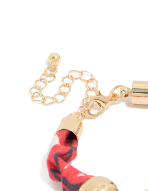 Designed with beads accents in gold and red, this wrapped bracelet with stones closure detail view