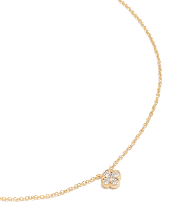 Featuring a floral necklace with gold plated cubic zirconia and crystal pendant in a dainty style close up view