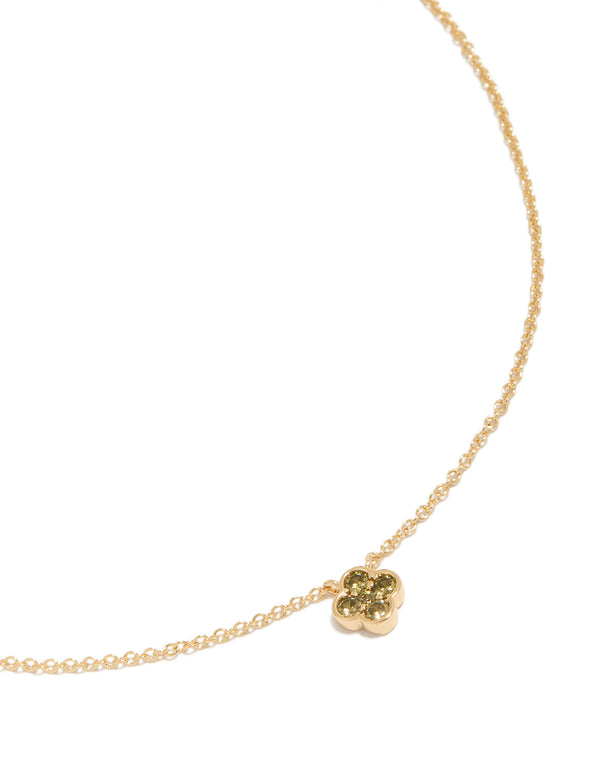 Showcasing a gold plated peridot August flower necklace with floral pendant in dainty design close up view