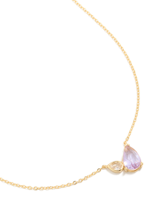 Showcasing a gold plated June lilac cubic zirconia necklace featuring crystal pendant in dainty style close up view