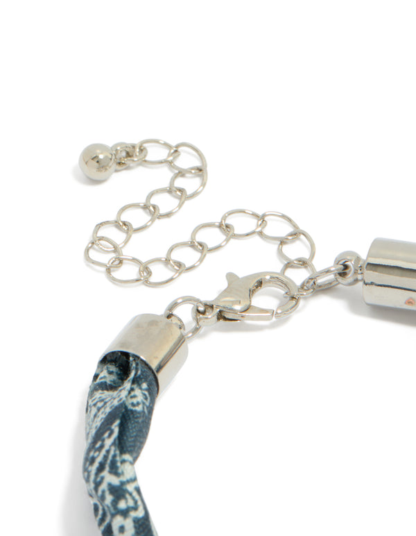 Designed with adjustable chain closure, this paisley fabric bracelet ensures secure fastening closure detail view