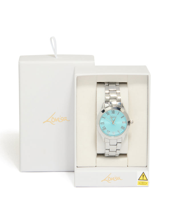 Elegantly presented women's watch with roman numeral blue dial, round shape, casual analog design, link band strap in silver case detail view