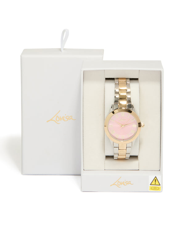 Beautifully presented mixed metal pink face roman numeral watch with numbers on a round dial, designed for women in casual wear, featuring a multi-color link band and analog type case detail view