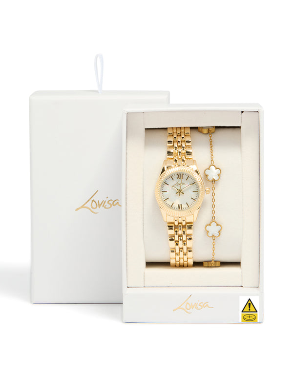 Beautifully boxed gold watch and flower bracelet set with white dial, roman numerals, round shape, formal occasion accessory, link band, and analog mechanism watch face detail view