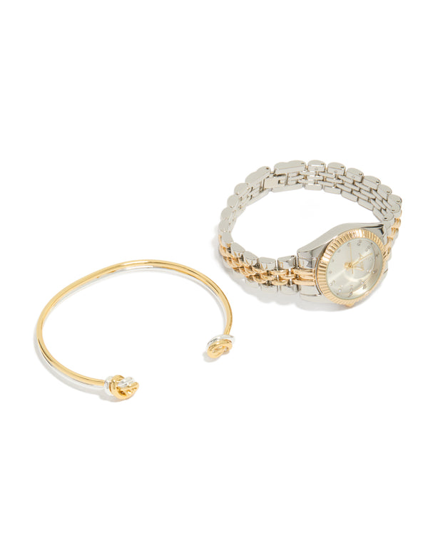Elegantly styled mixed metal knotted wrist cuff and watch set featuring silver dial with stone look, round shape, link band designed for women's formal occasions, analog type, silver plated material, gold accents front view