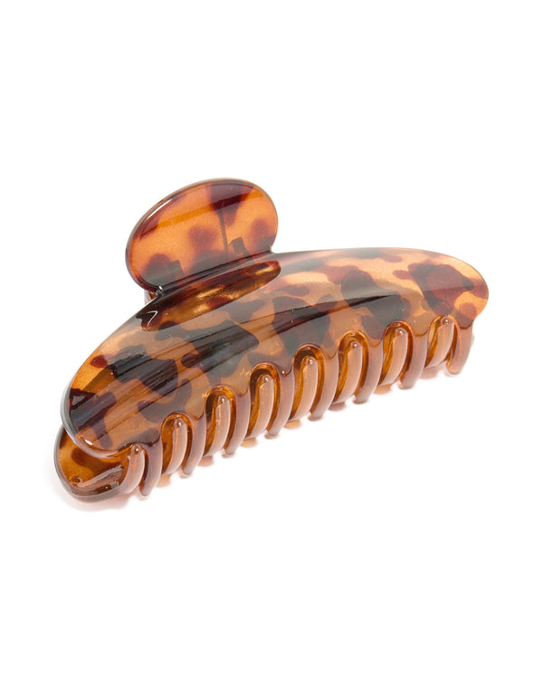 Tortoiseshell arched claw clip in chocolate sienna and peru tones front view