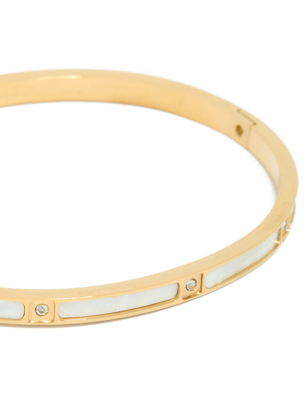 Elegant waterproof gold plated stainless steel hinged bangle with cubic zirconia and white enamel inlay close up view