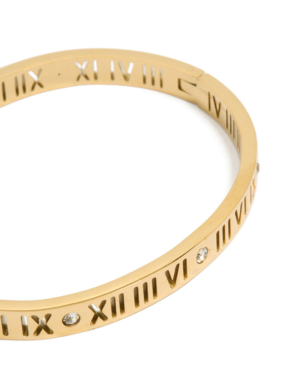 Crafted from waterproof gold plated stainless steel, this cubic zirconia roman numeral hinged bangle close up view