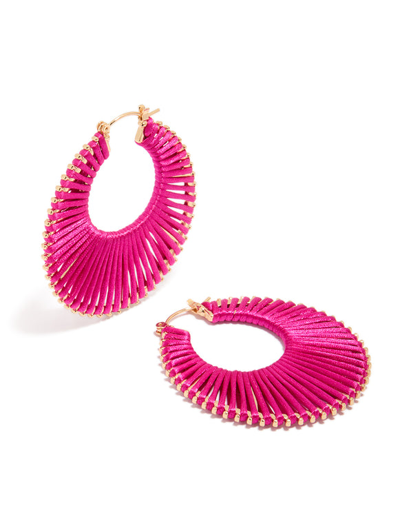 Showcasing statement hoop earrings in hot pink and gold front view