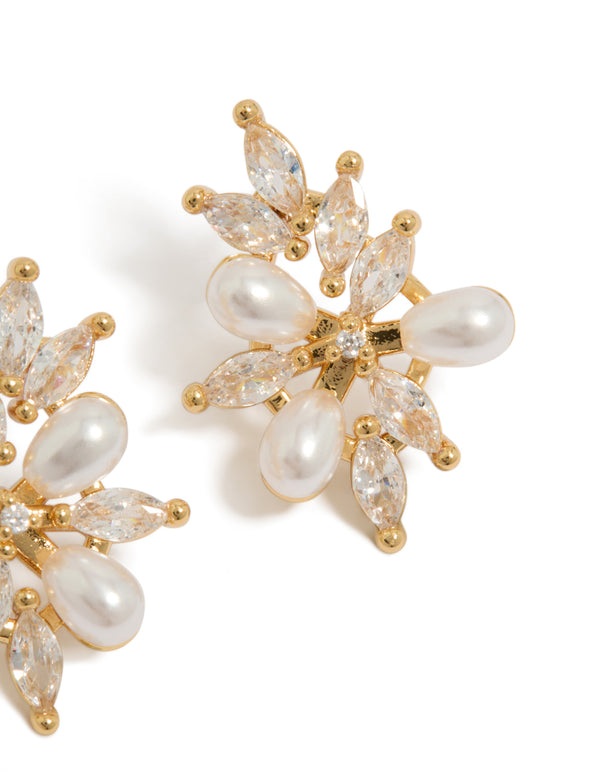 Showcasing organic flower statement earrings in gold plated metal with pearls and cubic zirconia in ivory post detail view