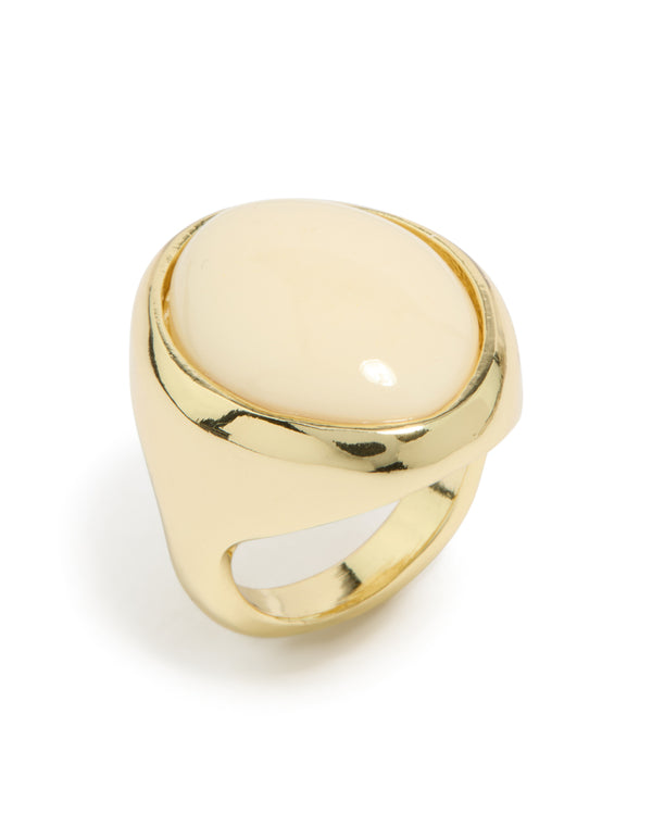 Featuring a gold plated chunky oval cream stone ring with statement appeal close up view