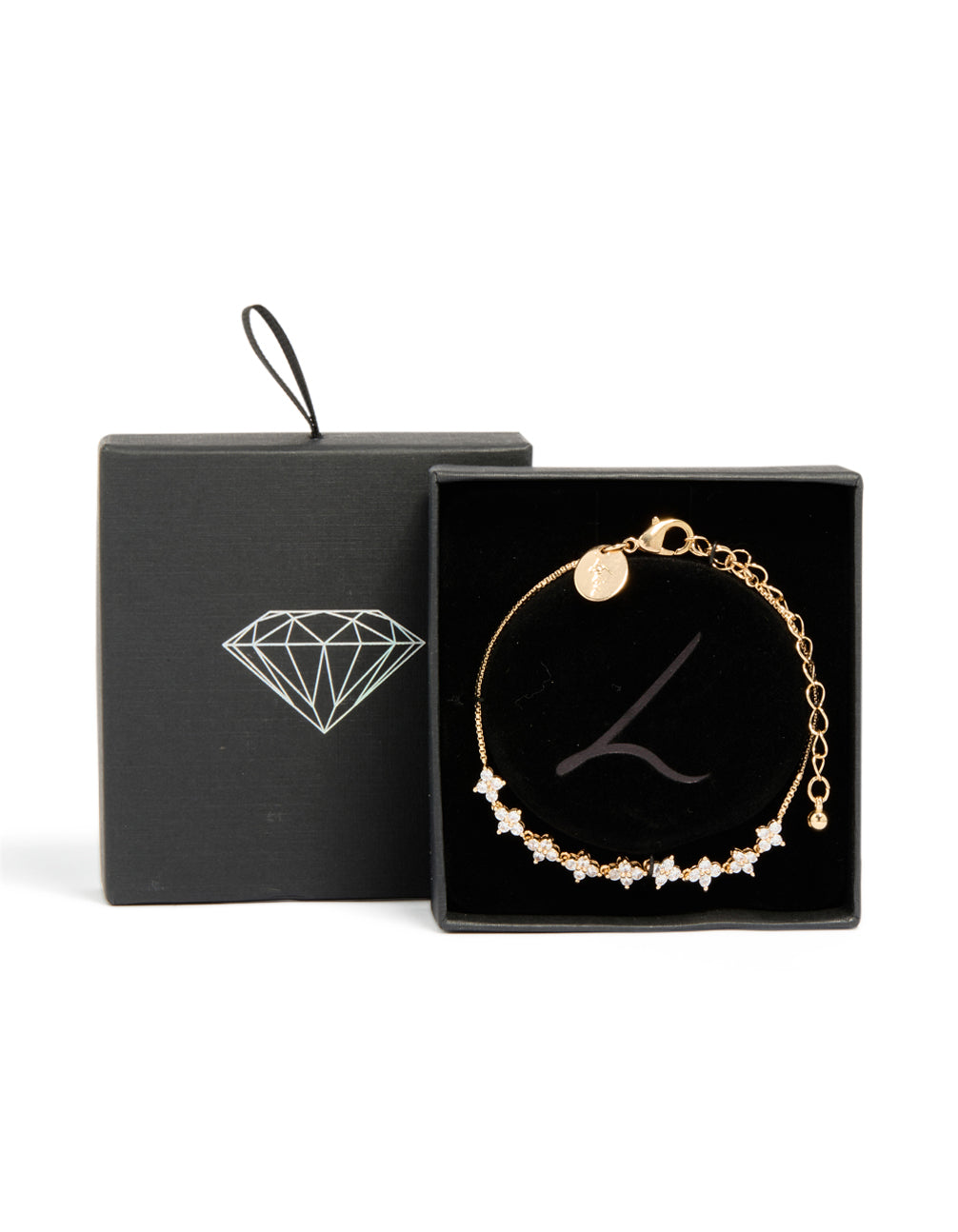 Designed with gold cubic zirconia fine floral bracelet and dainty details closure detail view