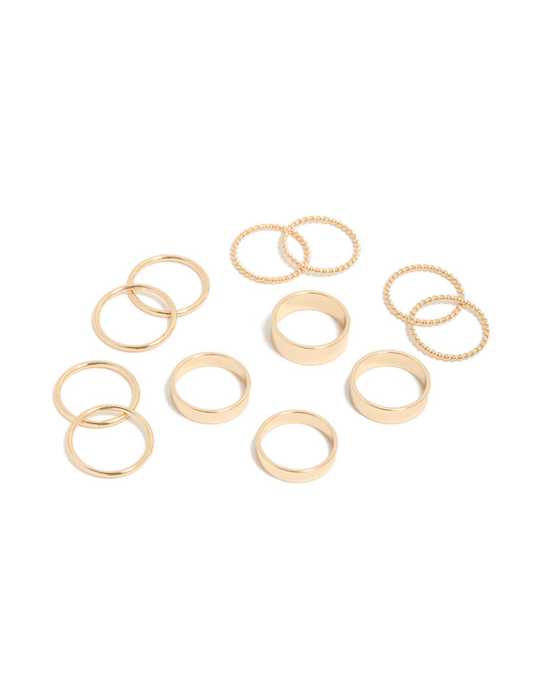 Featuring eight gold thick and simple rings with beaded textures front view