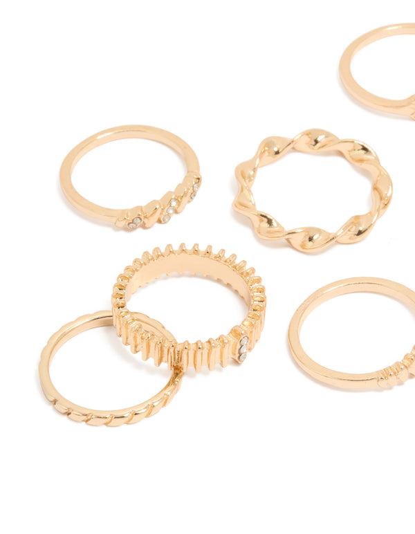Statement gold signet and ribbed rings showcasing celestial star in a 10-pack close up view