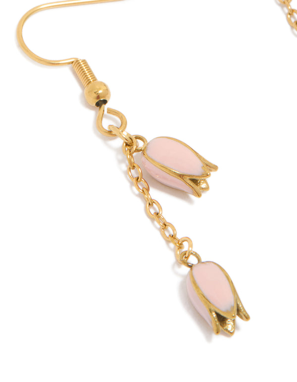 Beautifully designed waterproof drop earrings featuring pink tulips in gold plated stainless steel with charm details close up view