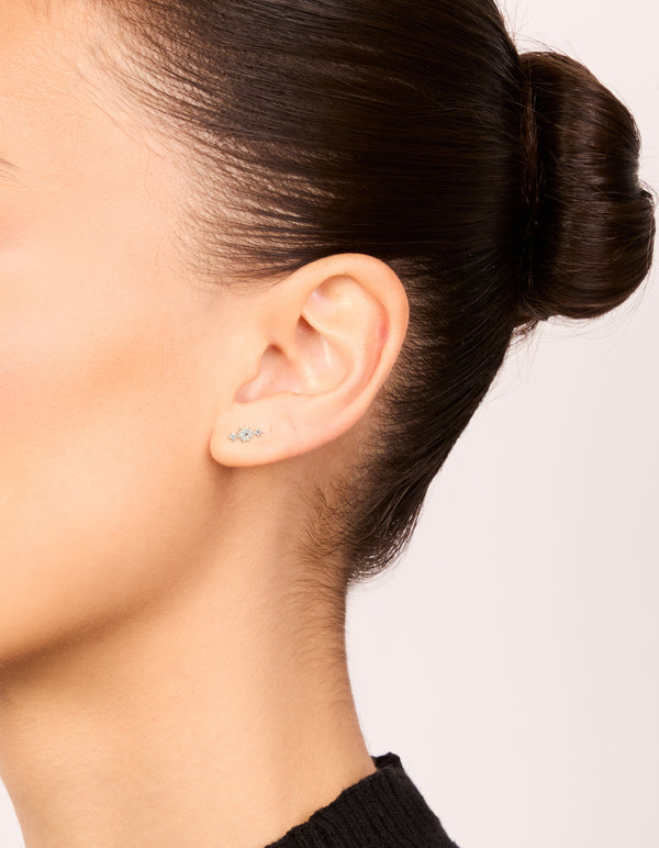 Waterproof stainless steel textured cubic zirconia trio flat back studs in silver and clear on ear view
