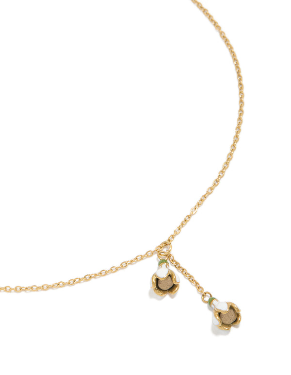 Showcasing a waterproof forget-me-not charm necklace in gold plated stainless steel close up view