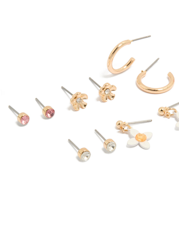 Crafted from gold with diamante and floral stud earrings in an 8-pack showcasing pink, white details close up view