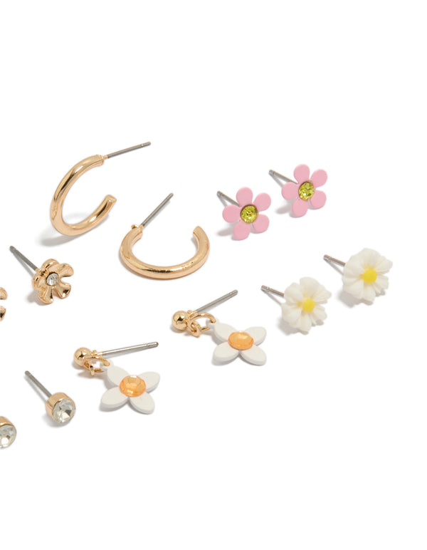 Crafted from gold with diamante and floral stud earrings in an 8-pack showcasing pink, white details close up view