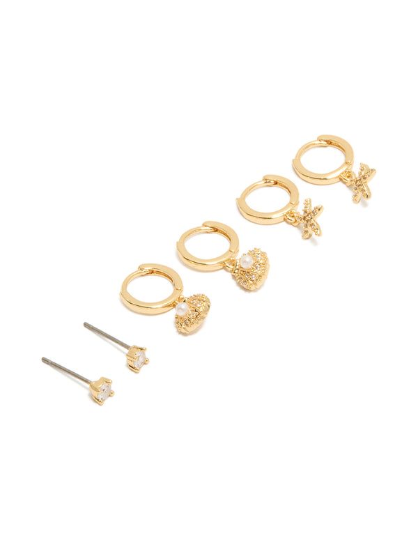 Showcasing a gold plated cubic zirconia studs and mini starfish huggie earrings 3-pack with ocean featuring crystal shell and pearl front view