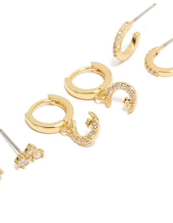 Crafted from celestial charm gold plated cubic zirconia and crescent moon hoop earrings 3-pack with crystal huggie closure in clear stone close up view