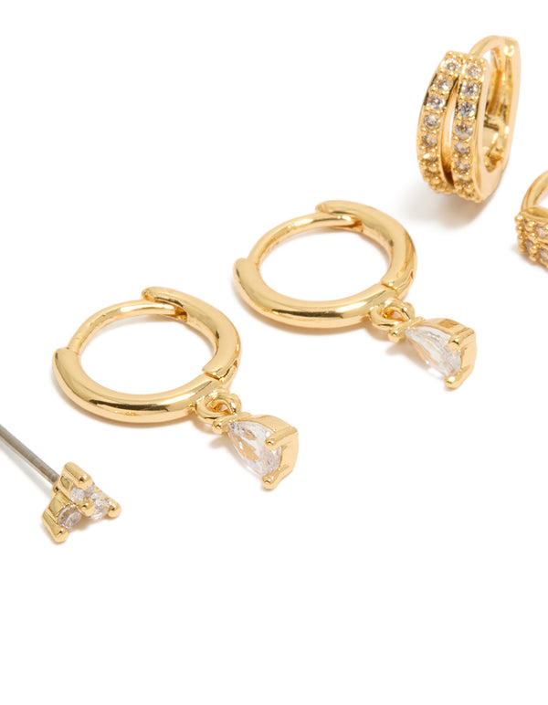 Showcasing dainty earrings with huggie closure in gold plated cubic zirconia crystal 3-pack close up view