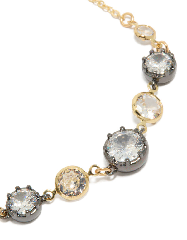 Designed with mixed metal cubic zirconia crystals in gold plated toggle bracelet close up view