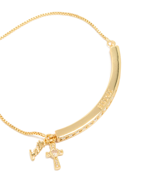 Highlighting a gold plated cubic zirconia faith toggle bangle with charm cross and script detail close up view