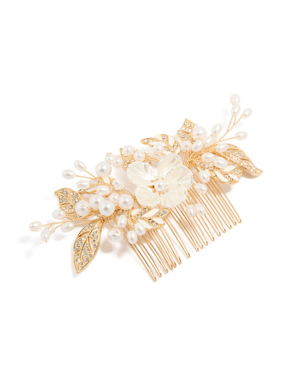 Beautifully crafted floral hair comb with leaf accents, pearl embellishments, and ivory petals in gold front view