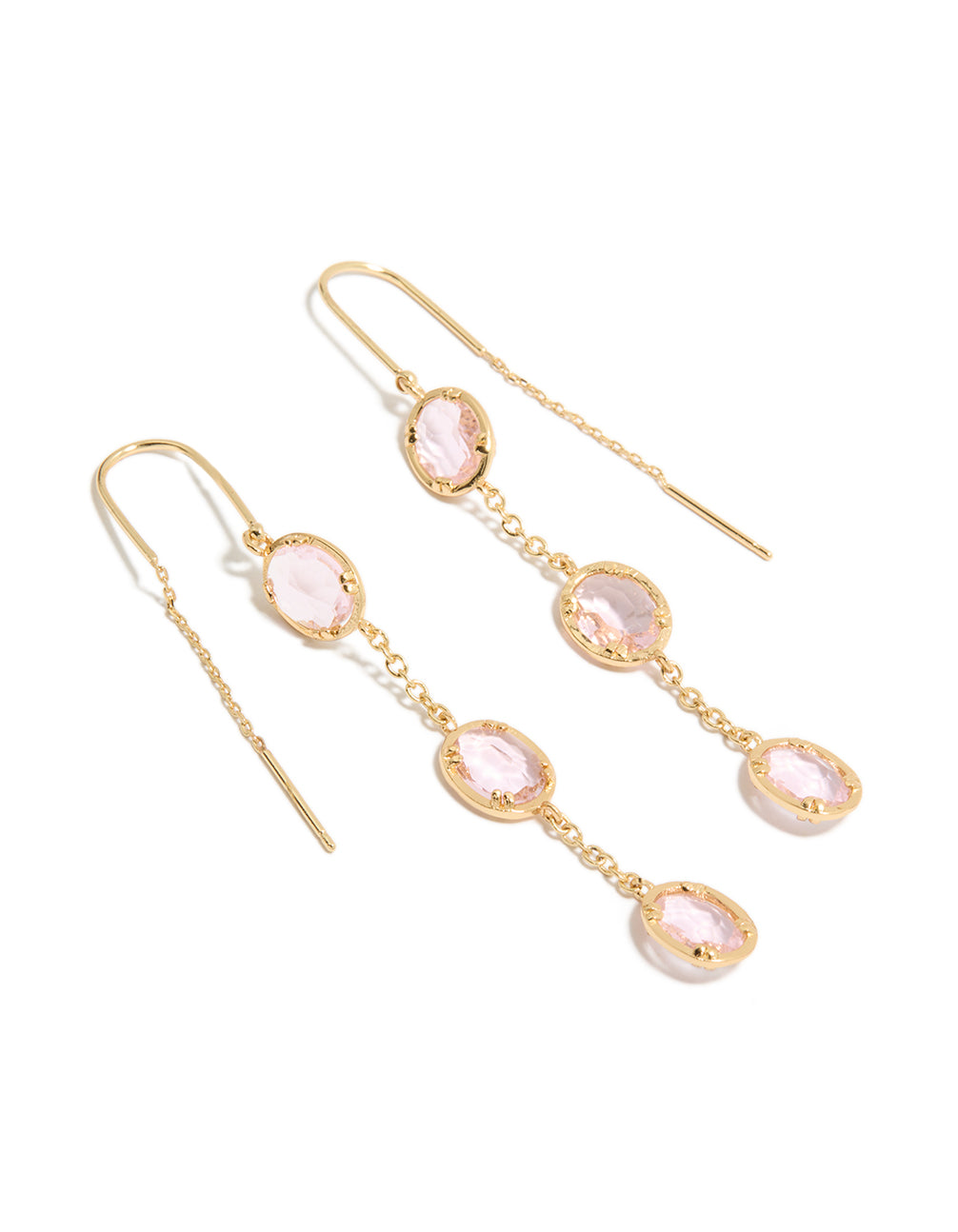 Showcasing statement dainty thread through earrings with oval pink diamantes in gold plated finish front view