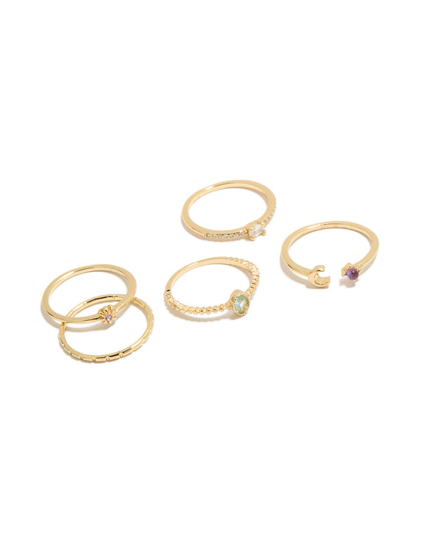 Stunning five-piece celestial set featuring moon and sun motifs in gold plated cubic zirconia oval cut dainty rings front view