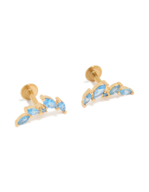 Featuring crawler flat back studs crafted from gold plated surgical steel with light sky blue cubic zirconia stones front view