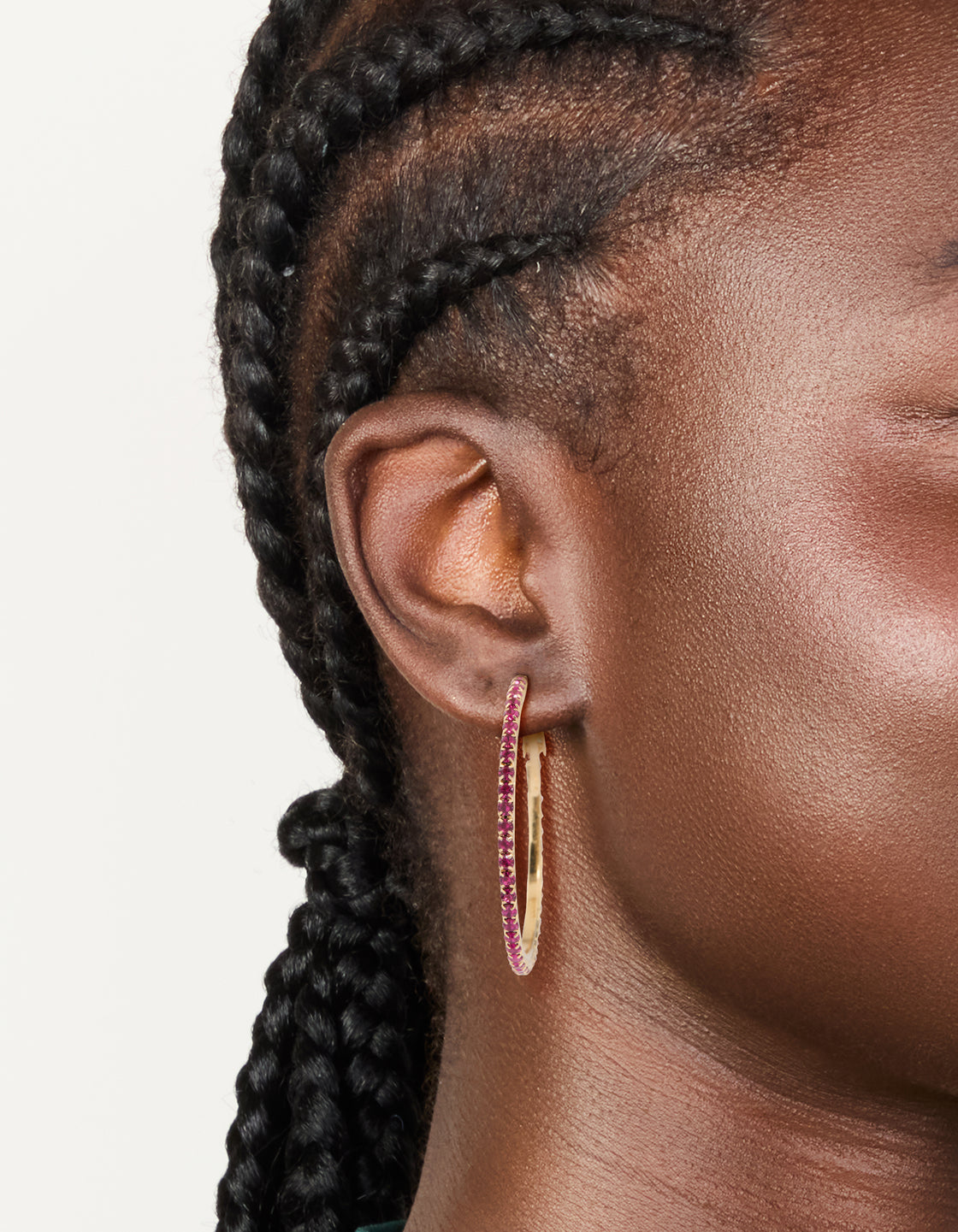 Featuring gold clear and pink diamante mixed size hoop earrings in a 3-pack on ear view